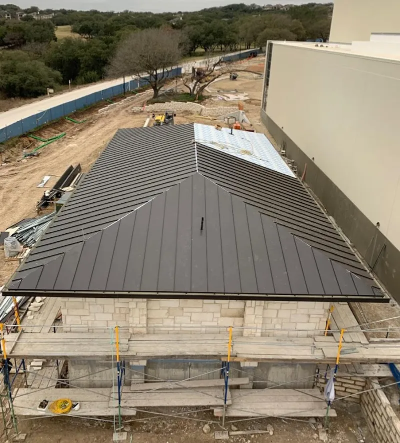 Metal roof new construction with scaffolding in Caldwell